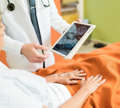 imgi_42_midsection-doctor-showing-xray-report-digital-tablet-senior-patient-hospital_662251-3059