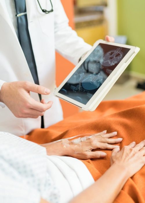 imgi_42_midsection-doctor-showing-xray-report-digital-tablet-senior-patient-hospital_662251-3059