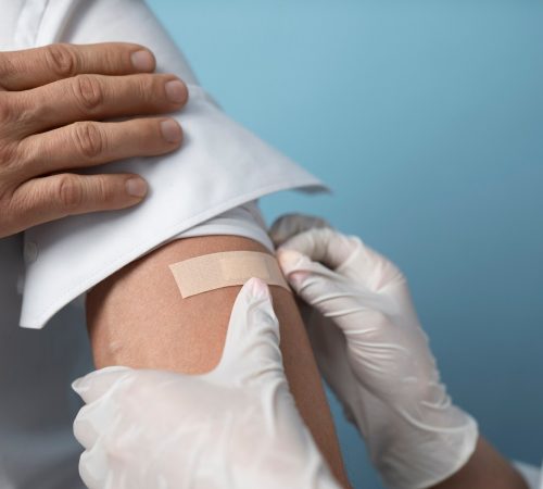 imgi_52_high-angle-patient-wearing-band-aid_23-2149452495