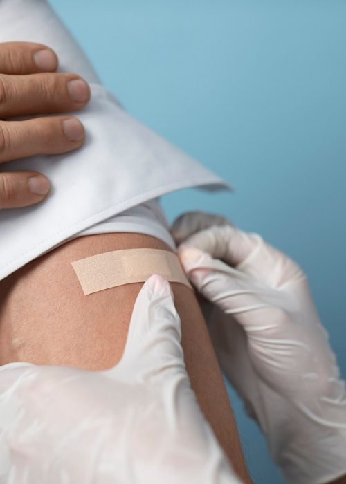 imgi_52_high-angle-patient-wearing-band-aid_23-2149452495